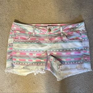 geometric print blue jean shorts with fringe legs